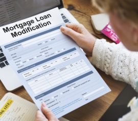 Woman staring at the loan modification form.