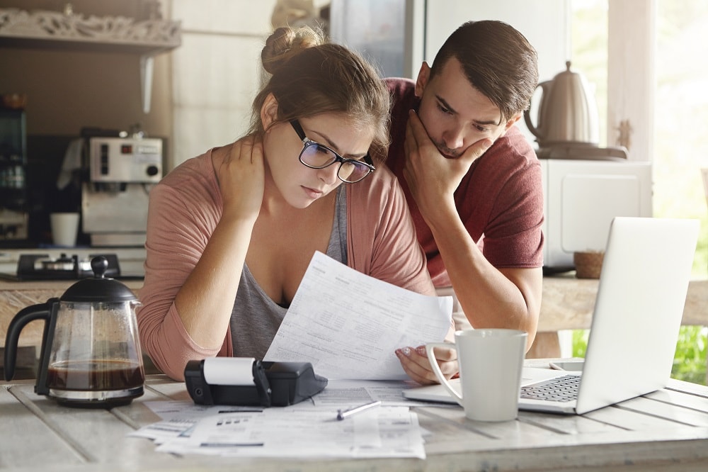 Young couple having debt problems on how to pay their loans.