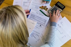 Woman in debt, planning to file for bankruptcy.