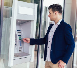 Man withdrawing his money at ATM